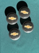 Dekielki kapselki na felgi Chevrolet 4 szt czarne grafitowe oryginał 60mm