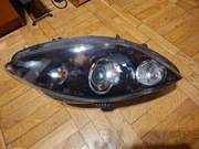 Biksenon skrętny, prawy, Seat Leon 1P polift 5P1941754E, ułamany zaczep.