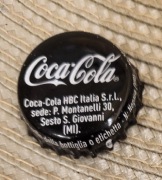 Kapsel Coca Cola butelkowane