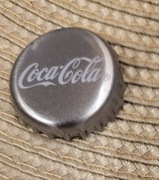 Kapsel Coca Cola butelkowane