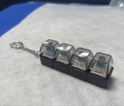 Brelok antystresowy Fidget 4 przyciski – klikacz do odstresowania