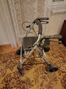 Chodzik na kółkach, rolator z hamulcami i siedziskiem dla odpoczynku 