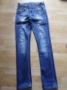 Proste jeansy z przetarciami Orsay 36