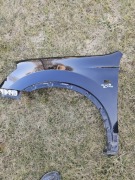 Nissan Qashqai I 2006-2010 błotnik lewy oryginał ze ślizgiem