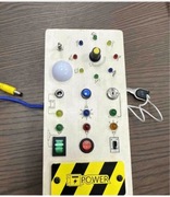 Tablica Montessori sensoryczna drewniana manipulacyjna led wlacznik swiatla