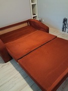 Sprzedam sofę dwójkę z możliwościa spania materiał sztruks