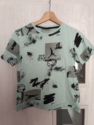 T-shirt dla chłopca motyw sportowy kolor zielono/czarny wzrost 146-152cm