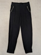 Czarne lejące spodnie haremki z kieszeniami suwakami Zara 36