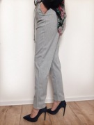 Spodnie damskie materiałowe szare z białym prążkiem kieszenie roz 36