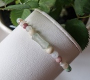 Bransoletka damska z kamieni naturalnych,pastelowa,regulowana,na sznurku 