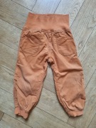 pomarańczowe spodnie sztruksowe