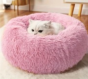 Okrągłe puszyste różowe legowisko dla kota lub psa