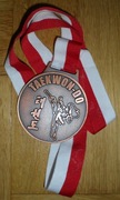 Pamiątkowy medal z zawodów TEAKFON-DO w Warszawie