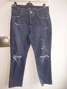 Spodnie z rozdarciami z szeroka nogawka 