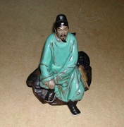 Ceramiczna figurka chińczyka.