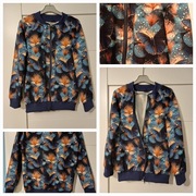 Nowy sweterek bomberka zapinana na zamek Motyl rozmiar 140