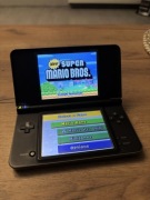 Nintendo DSi XL szara + gra New Super Mario Bros