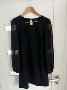 Czarna sukienka z przewiewnymi rękawami nexc