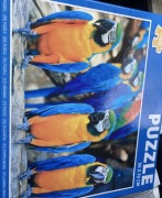 Puzzle 1000 szt 50x70 cm papugi jak nowe