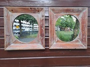 Owalne lustro w grubej drewnianej ramie