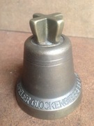 Dzwonek mosiężny gruby, sygnowany.