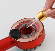 Masażer do skóry głowy z funkcją atomizacji wcierek i olejków