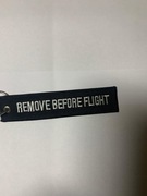 Haft "remove before flight" w kolorze czarnym