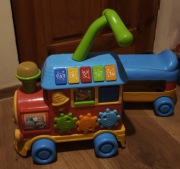 Ciuchcia smily Play pociąg jeździk pchacz zabawka dźwiękowa 