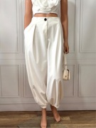 Stylowe spodnie w kolorze białym w modnym kroju baggy alladynki r. M L