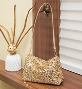 Złota cekinowa kopertówka na sylwestra 