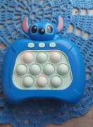 zabawka popit niebieski grający na baterie stitch