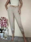 Spodnie dresowe ze złotymi guzikami wiązane elastyczne dresy wiskoza