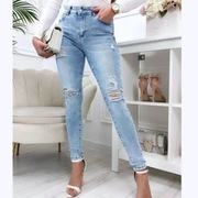 Jeansy z dziurami XL