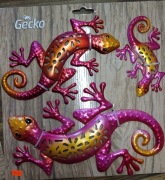 Dekoracje ścienne w kształcie gekonów, w kolorze pomarańczowo-różowym. 