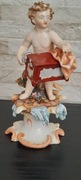 Figurka porcelanowa putto z katarynką Richard Eckert-1894 Niemcy 
