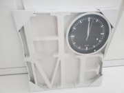 Zegar w napisie  HOME nowy