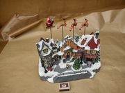 Miasteczko bożonarodzeniowe z ruchomymi reniferami melodią .