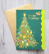 Kartka grająca bożonarodzeniowe z muzyką z kopertą Wesołych Świąt.