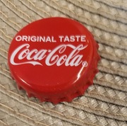 Kapsel Coca-Cola butelkowane