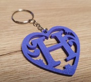 Brelok z literką.