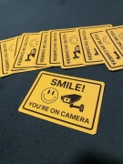 Naklejki Wlepy Smile you're on camera 8.5x6cm 10szt Żółte