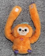 Interaktywna małpka robi przewroty gra melodie