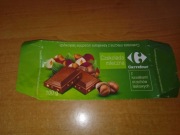Carrefour czekolada mleczna z kawałkami orzechów 2010 puste opakowanie