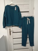 Dres w kolorze morskim uniwersalny, frędzle przy rękawie. 8