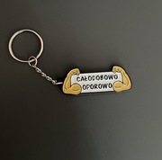 Metalowy brelok ''Całodobowo oporowo''. Prezent