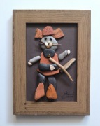 Kot w butach, obrazek wykonany z kamyków i patyków zebranych na plaży.