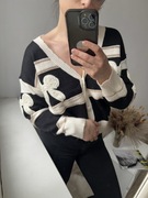 Krótki, czarno-kremowy kardigan w kokardki