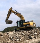 Praca operator koparki gąsienicowej CAT Radzymin