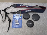 Zestaw akcesoriów Canon EOS: pasek + 3 dekielki + 2 baterie Varta