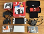 Nintendo Switch OLED (biały) – zestaw (Pro Controller + gry + dowód zakupu)